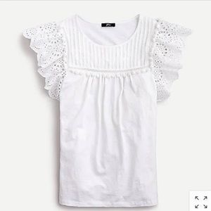 Eyelet flutter-sleeve top with pom-pom trim